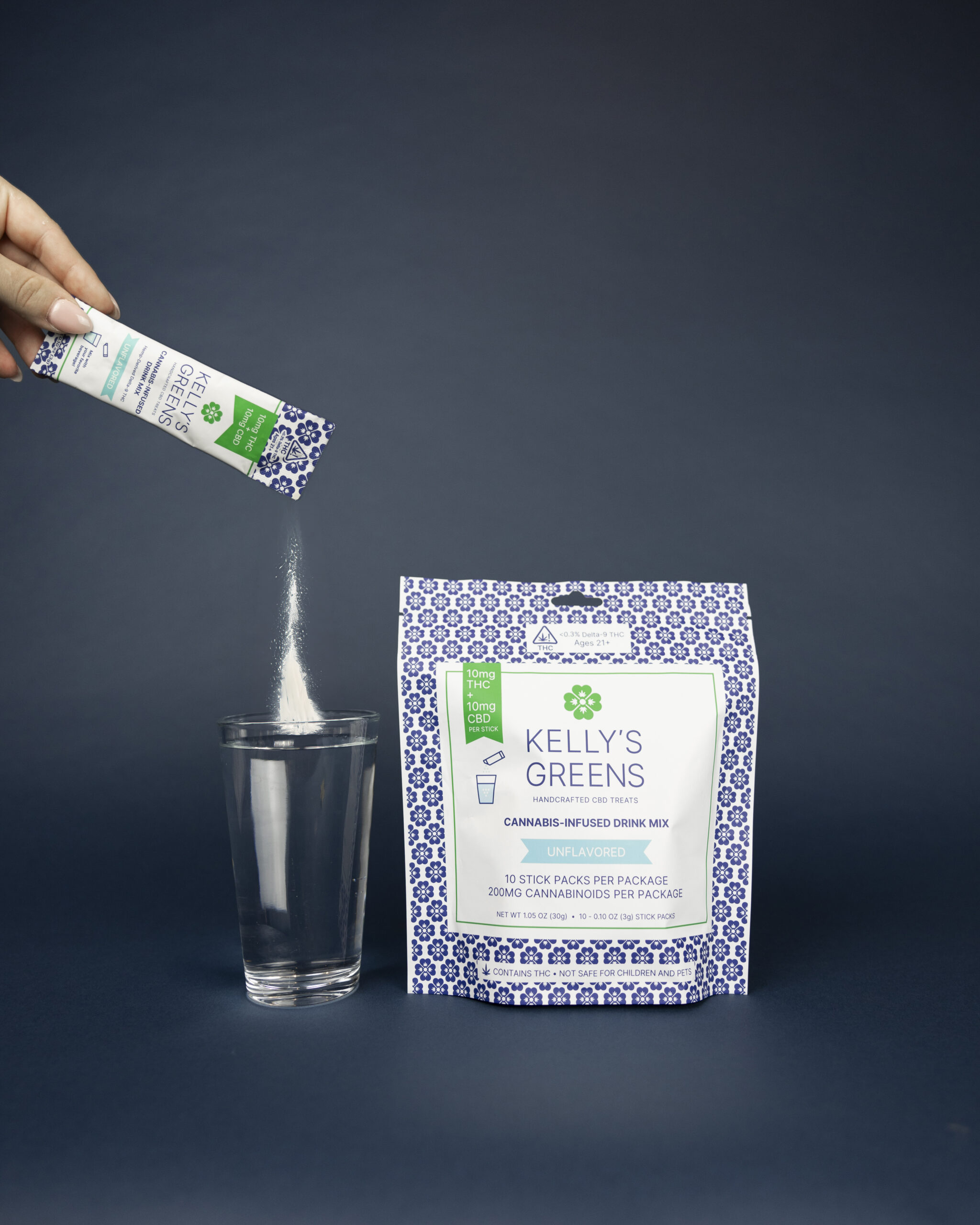 Cannabis infused powder pouring slowly into a glass of water